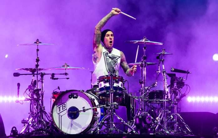 Travis Barker made an electrifying appearance on Kai Cenat’s Twitch stream, “Mafiathon 2,” surprising the streamer with a 13-minute drum solo while he slept.